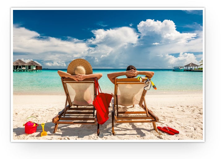 A couple sitting on the beach.