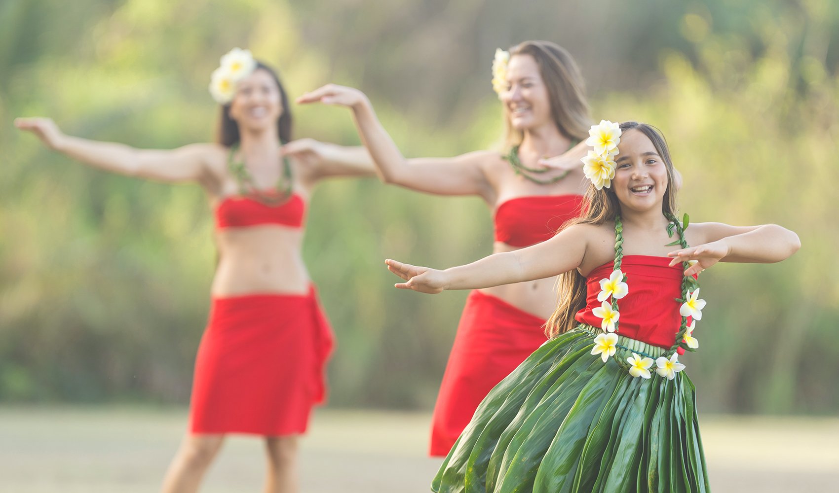 Three girls doing the hula dance