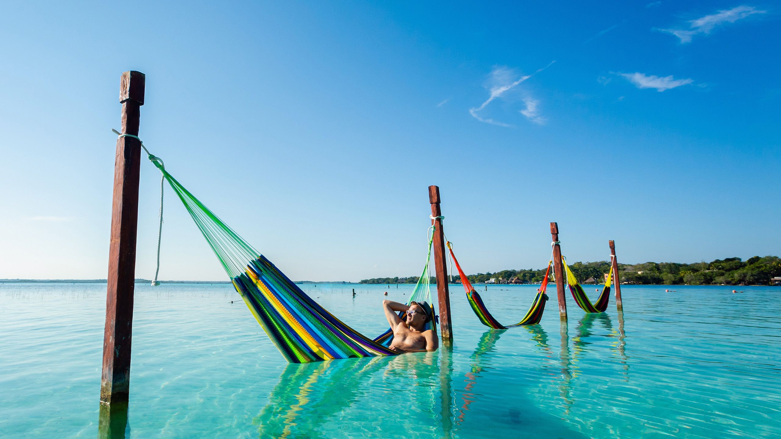Man in a hammock in the ocean in Mexico